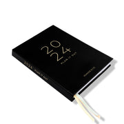 2024 a4 weekly planner laying on side by Ronnie & Co